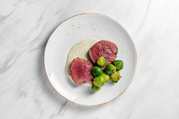 Filet mignon steak with Brussels sprouts