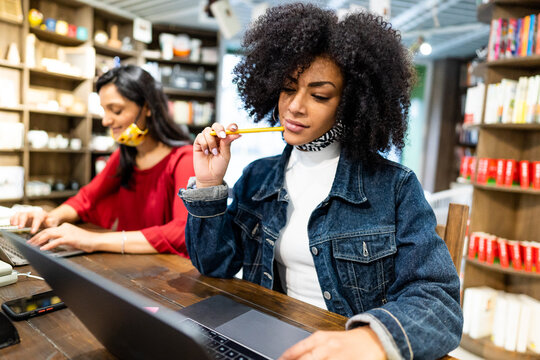 Multiracial Young Girls Studying With Face Mask After New Wave Of Covid Infections