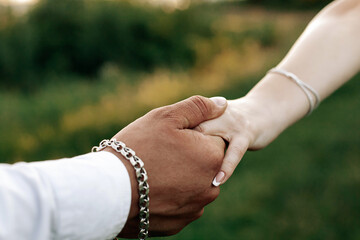 Hands of a couple in love