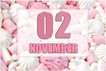 calendar date on the background of white and pink marshmallows.  November 2 is the second  day of the month