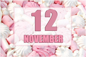 calendar date on the background of white and pink marshmallows. November 12 is the twelfth day of the month