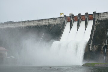 water splashing from floodgate Khun Dan Prakarn Chon huge concrete dam in Thailand 