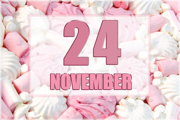 calendar date on the background of white and pink marshmallows. November 24 is the twenty-fourth  day of the month