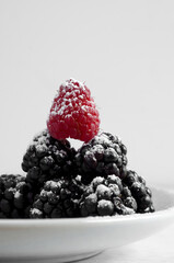 Macro of Delicious Blackberries with Raspberry and Powdered Sugar