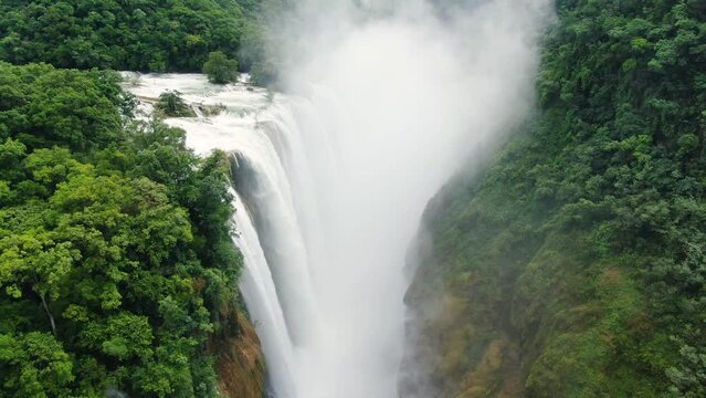 Wild Tamul waterfall landscape aerial drone.Awesome unspoiled forest cascade aerial vertical drone view. American Caribbean river cascade in the rainforest.
The tallest waterfall in the state.