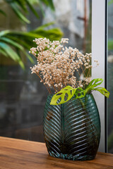 vase of dried flowers on the table