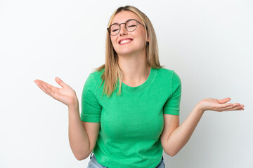 Fototapeta premium Young caucasian woman isolated on white background smiling a lot