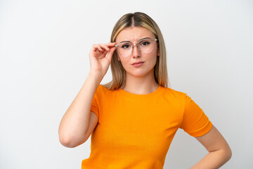 Young caucasian woman isolated on white background With glasses and frustrated expression