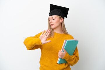 Young student caucasian woman isolated on white background making stop gesture and disappointed