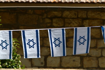 The blue and white flag of Israel with the six-pointed Star of David.