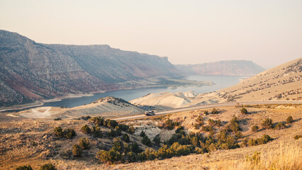 RV driving through southwest usa desert at sunset