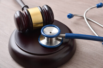 Fair social justice concept with gavel and stethoscope on table