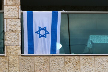 The blue and white flag of Israel with the six-pointed Star of David.