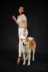 Fototapeta na wymiar Akita inu Dog and young Woman, Japanese akita dog