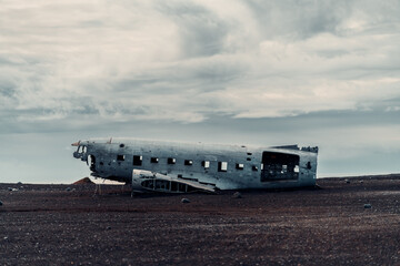 Wrecked plane on iceland black beach