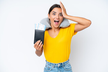 Woman with Inflatable Travel Pillow over isolated background with surprise expression