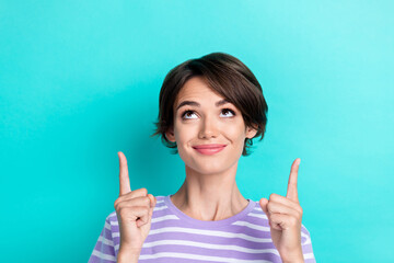 Portrait of girlish pretty woman bob hairstyle wear striped t-shirt indicating look empty space isolated on turquoise color background