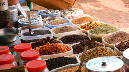 Different types of masala or spices on display for sale.