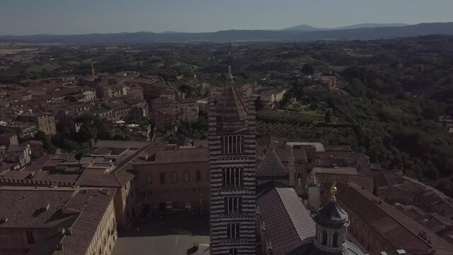 Siena Italy Cathedral Duomo in Tuscany, Drone Aerial footage during golden hour