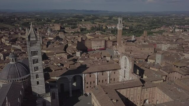 Siena Italy Cathedral Duomo in Tuscany, Drone Aerial footage during golden hour