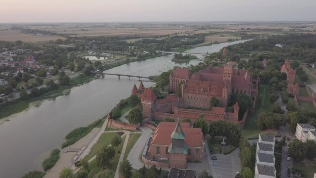 Malbork Castle and Nogat River in Poland Golden hour aerial drone footage