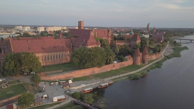 Malbork Castle and Nogat River in Poland Golden hour aerial drone footage