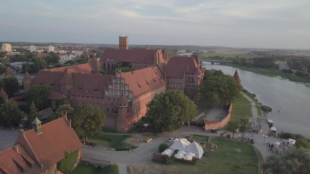 Malbork Castle and Nogat River in Poland Golden hour aerial drone footage