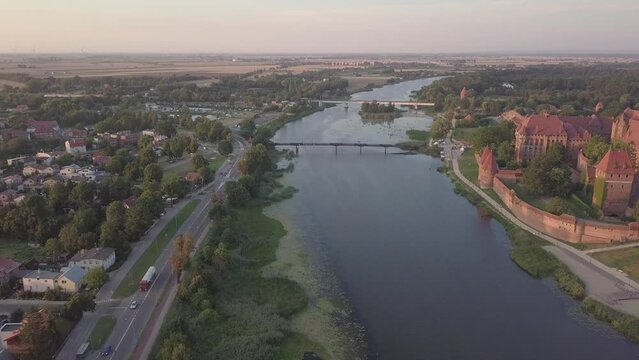 Malbork Castle and Nogat River in Poland Golden hour aerial drone footage