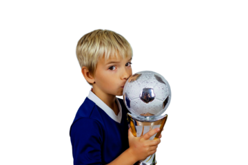 Young soccer player in blue jersey holds winners cup after the goal, isolated at light background