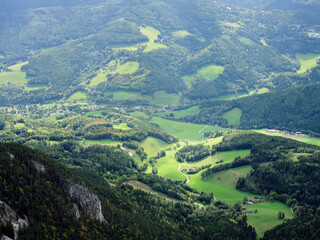 View of the surrounding villages and hills from the Rax mountain range in Austria