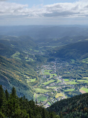 Fototapeta premium View of the surrounding villages and hills from the Rax mountain range in Austria
