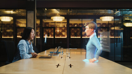Video call chat conference of an asian woman using hologram technology. Conversing with a cartoon character avatar of young man. Advanced technology. VFX. Augmented reality. - obrazy, fototapety, plakaty