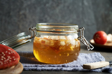 Preparation of herbal tincture from red fly agaric or amanita in a glass jar