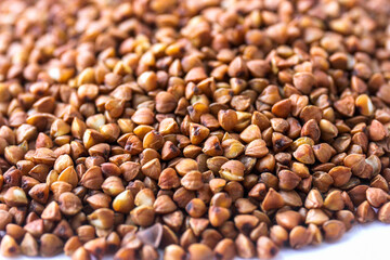 Buckwheat grains on a white background