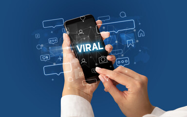 Hand using smartphone with social media concept