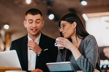 Modern man and woman use modern devices, laptop, tablet and smartphone and arrange new projects for the job. Business concept .