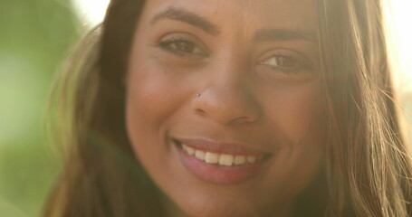 Fototapeta premium Latina black girl smiling portrait in sunlight outside