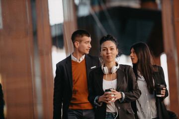 Elegant businesspeople walking in a modern city..