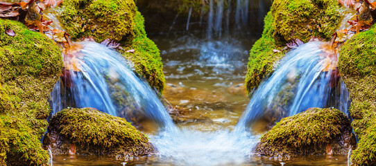 closeup small waterfall on mountain river flow through autumn mountain canyon