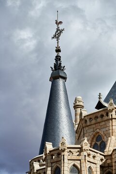 Building facade of episcopal palace of Astorga under blue bright sky in Spain
