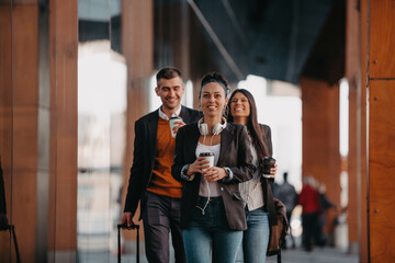 Elegant businesspeople walking in a modern city..