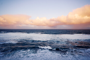 Fototapeta na wymiar Amazing sunrise on Atlantic ocean. Waves and foam.