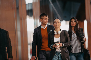 Elegant businesspeople walking in a modern city..