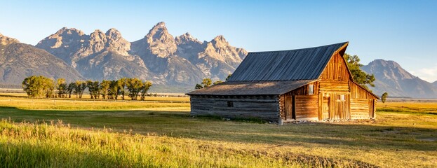 Wooden house in a field in Mormon Row, Utah and Yellowstone National Park - obrazy, fototapety, plakaty