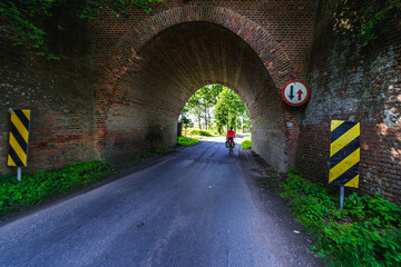 Road under railroad bridge in Gryfino County, Poland