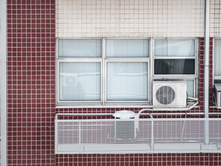 Air conditioner on building wall, outdoors in the building window. Climate equipment. .