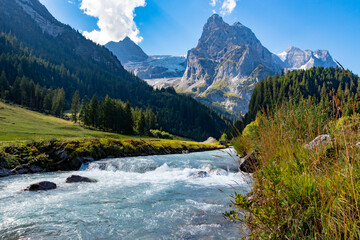 Rychenbach river in Meiringen, Bern, Switzerland. This river gets its water from the Rosenlaui Glacier. Photo taken in Reichenbachtal valley