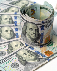 Money, US dollar bills background. Paper money is scattered on the table with silver coins. Photo for finance and economics concepts.