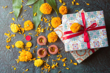 Indian Festival diwali concept. Gift box and oil lamp on festival background.