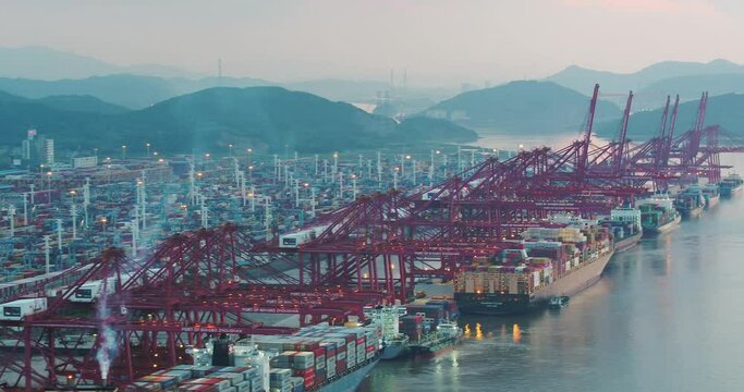 aerial view of commercial dock by river in ningbo at twilight